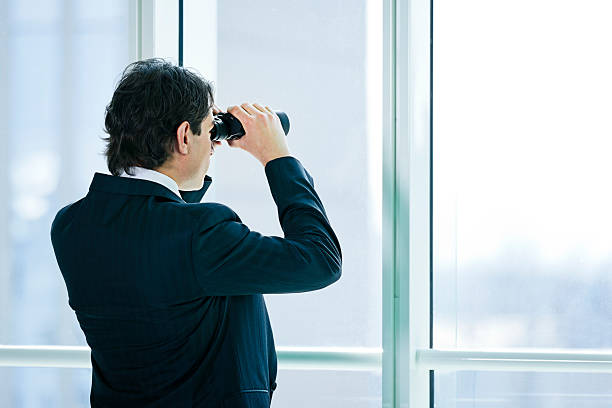 Businessman with binoculars. http://santoriniphoto.com/Template-Business.jpg