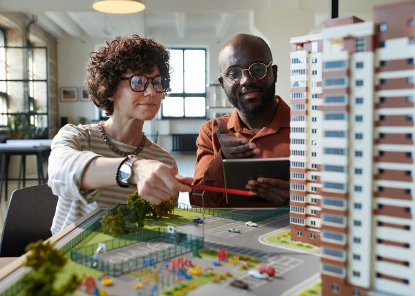 resilient-city-planning_internal3 Two architects discussing construction mock-up of building development