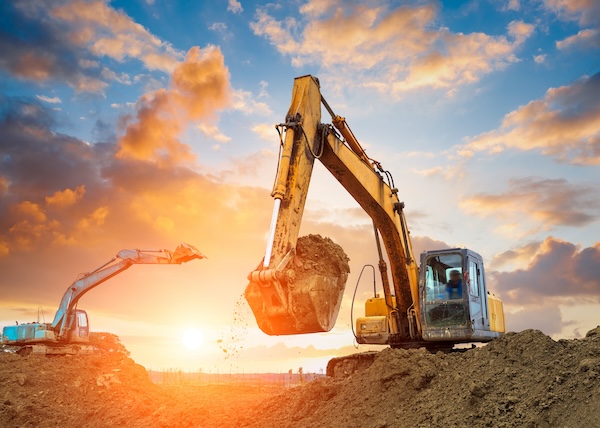 Greenfield-Brownfield Images-Internal2-600x428 excavation equipment on a construction site against a sunset sky backdrop